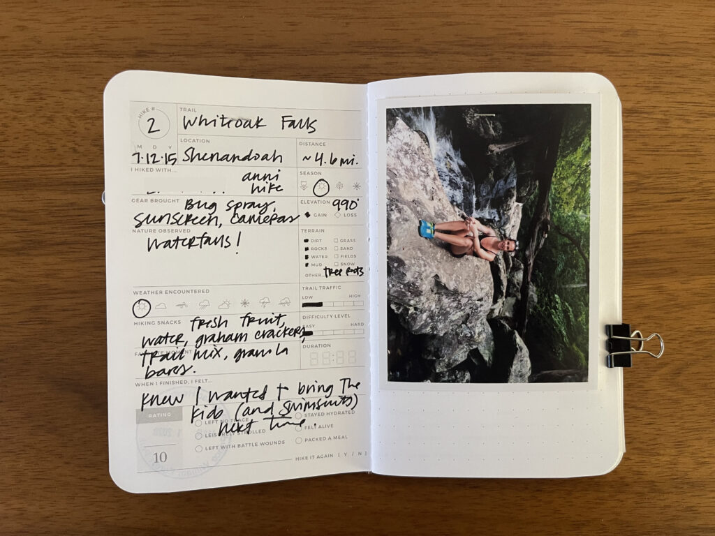 Spread of my Whiteoak Falls hike in Shenandoah National Park, Virginia. Details about the hike are written on the left page, a photo of me from the hike is on the right page, with the date of the hike stamped beneath it.