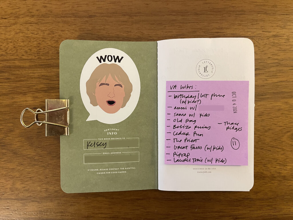 The inside cover of one of my Hike Passports featuring a sticker in the shape of a speech bubble with an illustration of Owen Wilson's face in the center and the word WOW above it.