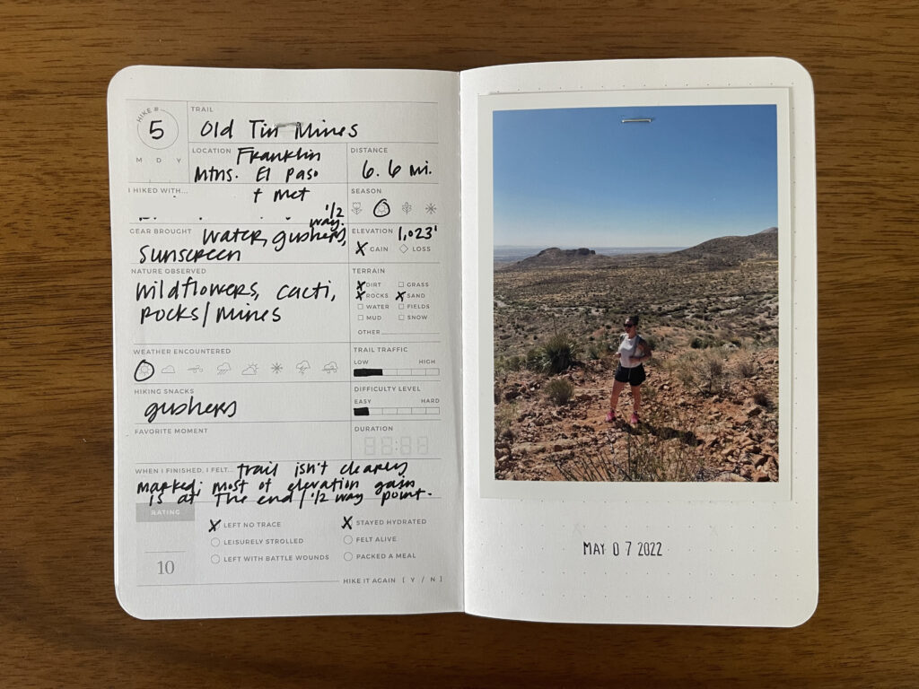 Spread of my Old Tin Mines hike in El Paso's Franklin Mountains. Details about the hike are written on the left page, a photo of me from the hike is on the right page, with the date of the hike stamped beneath it.