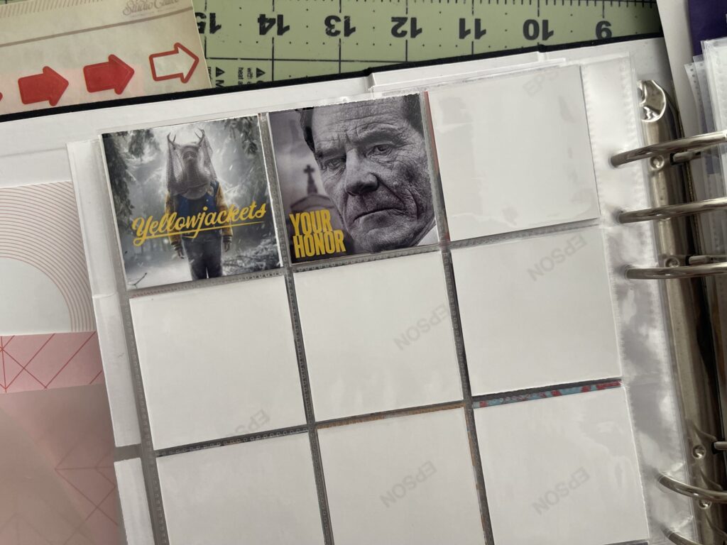 Another spread of two 6-inch by 8-inch page protectors, each divided into pockets measuring 2 inches by 2 inches. Two of the pockets are each filled with a 2-inch by 2-inch thumbnail of a TV show I watched in 2024. 
