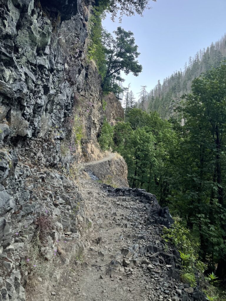 A section of very narrow, rocky trail with a vertical drop-off on one side (and no handrail on the other).