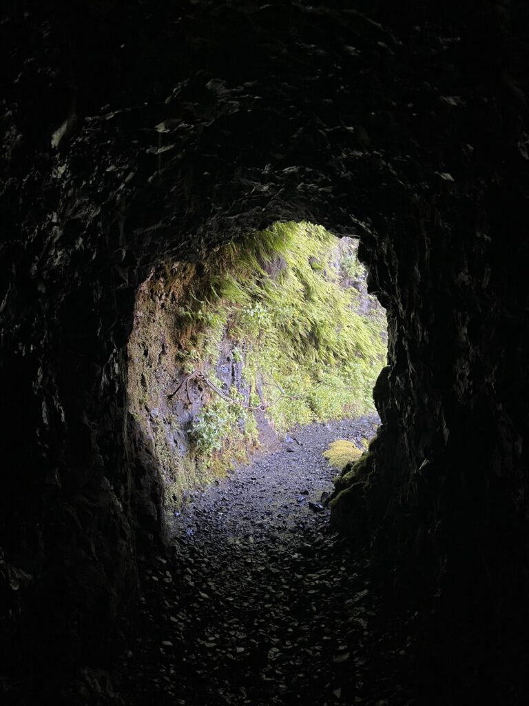 View from the tunnel behind Tunnel Falls looking from one end to the other.