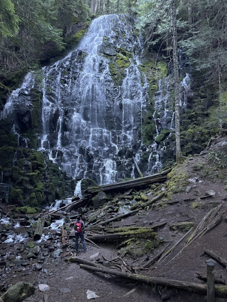 Me, from behind, looking up at the enormous Ramona Falls waterfall. 