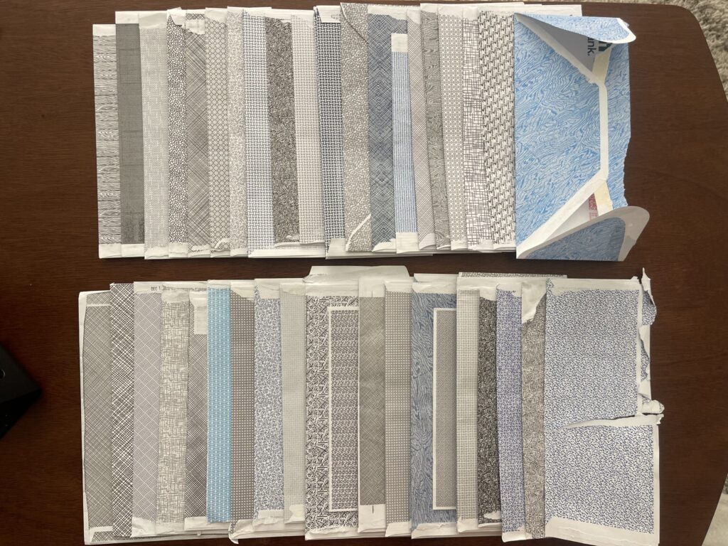 My full collection of security envelope patterns in different shades of black, grey, and blue. 