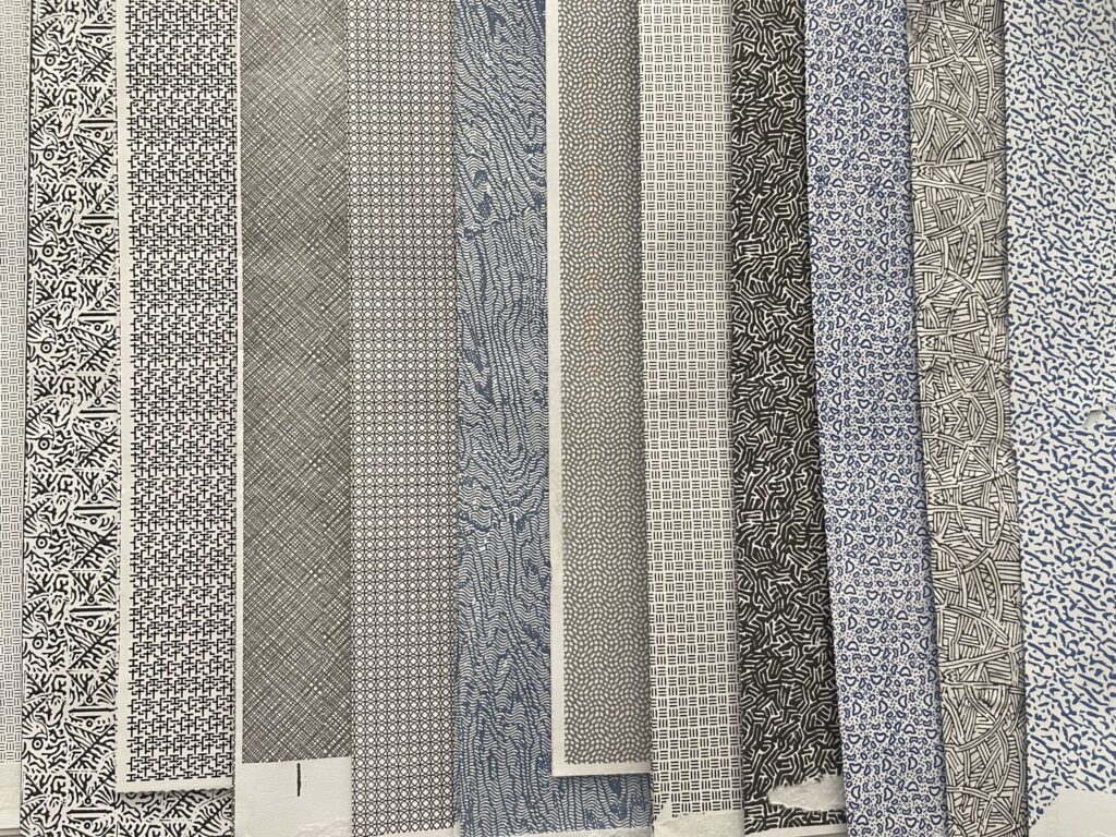 A variety of security envelope patterns in different shades of black, grey, and blue. 