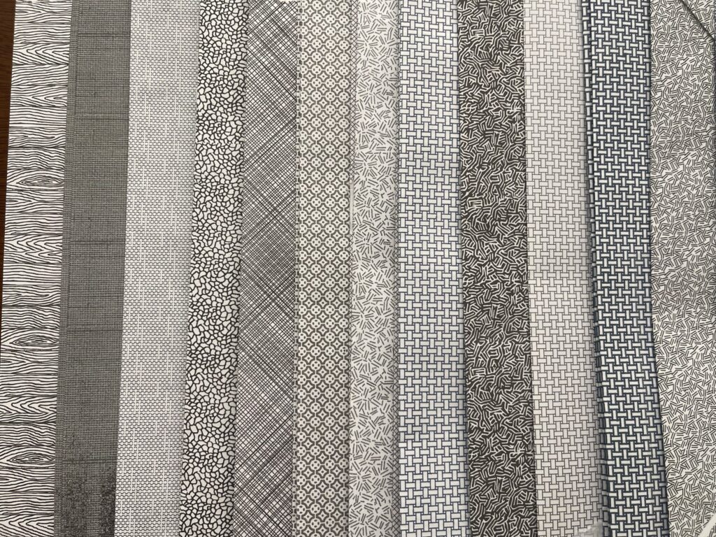A variety of security envelope patterns in different shades of black, grey, and blue. 