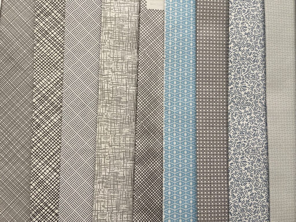 A variety of security envelope patterns in different shades of black, grey, and blue. 