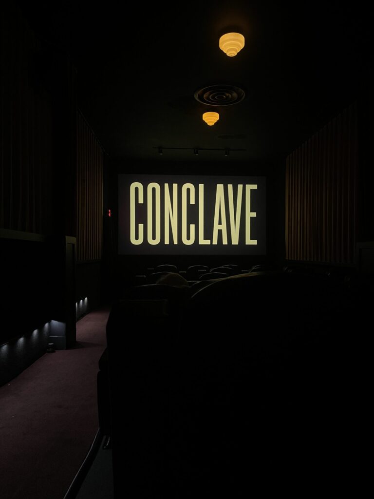 Title screen of "Conclave" as seen from the very back of the theater at Laurelhurst Theater in Portland, OR.