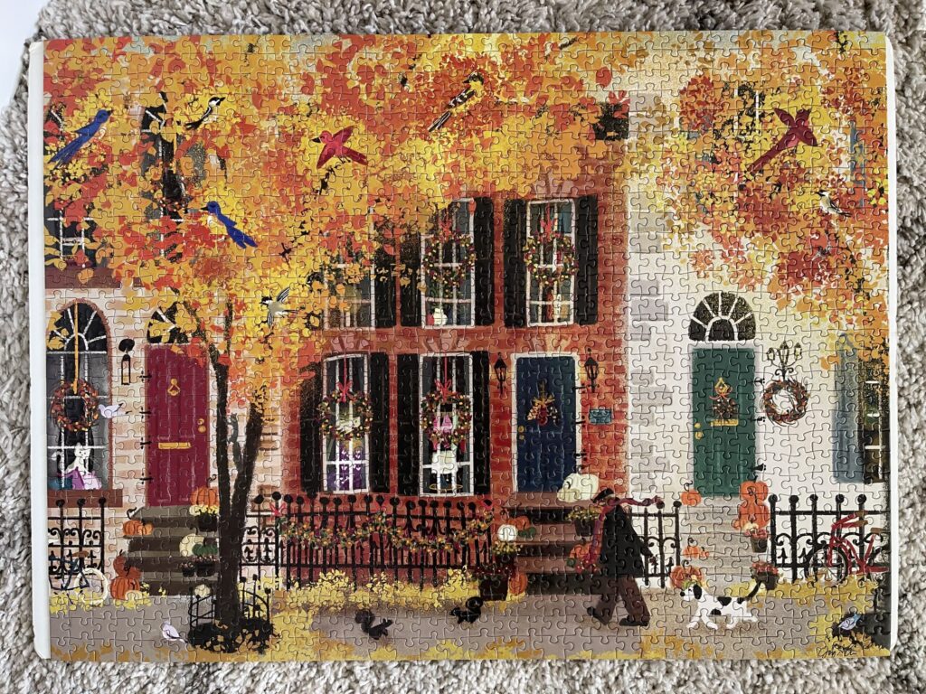 A 1,000-piece puzzle of a fall city neighborhood scene. 
