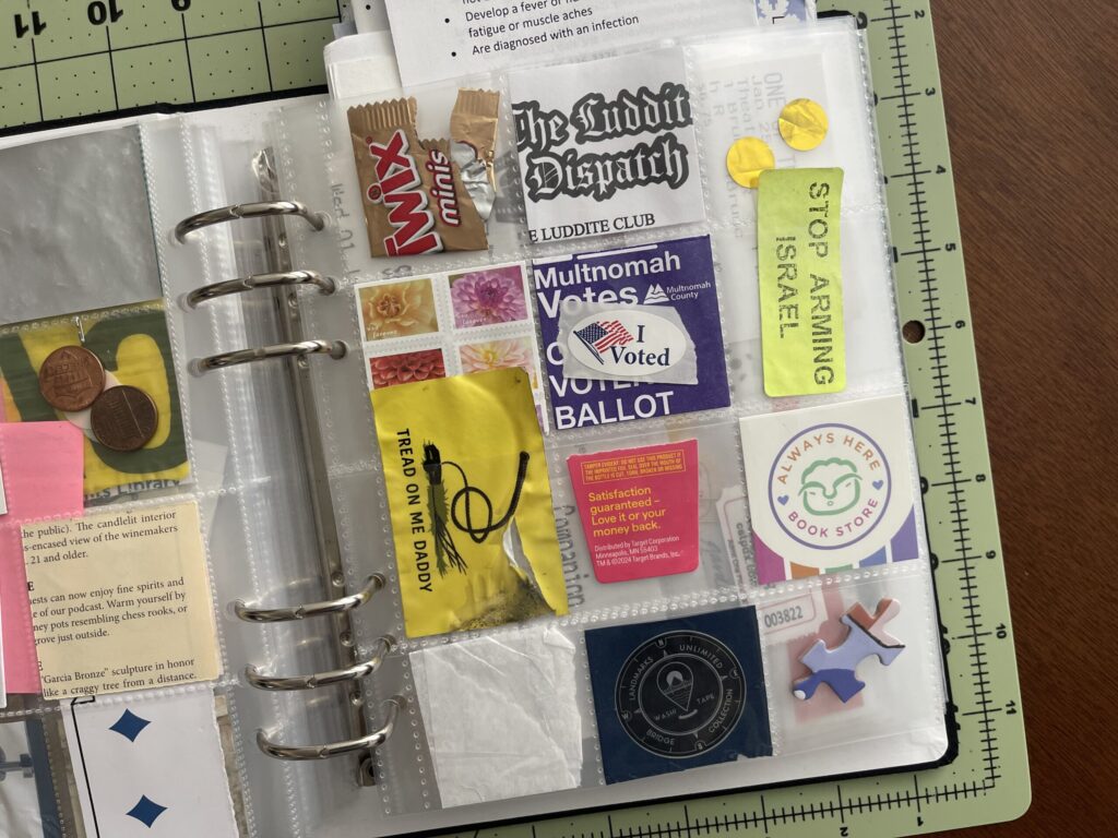 A 6-inch by 8-inch page protector divided into 12 two-inch by two-inch pockets. Each pocket hold a piece of ephemera from my life in October 2025, as enumerated in the bulleted lists in the body of the post.