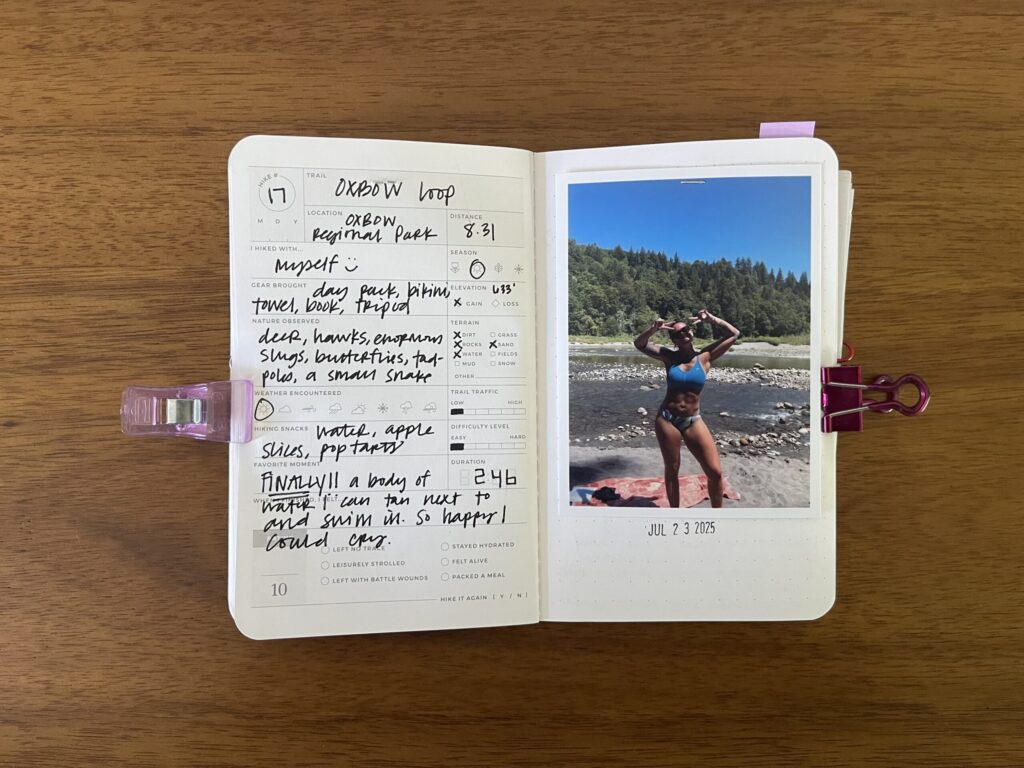 Spread of my hike of Oxbow Loop, an 8.31-mile hike in Oxbow Regional Park, summer 2025. Details about the hike are written on the left page, a photo of me from the hike is on the right page, with the date of the hike stamped beneath it.