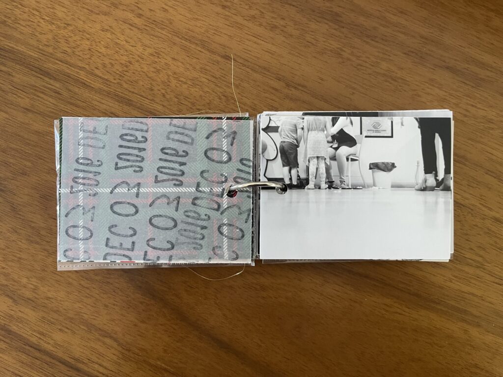 2016: the vellum page stamped with the date is flipped over to reveal a black-and-white photo of three kids in line to have their stuffed animals stuffed by the Build-A-Bear employee. 