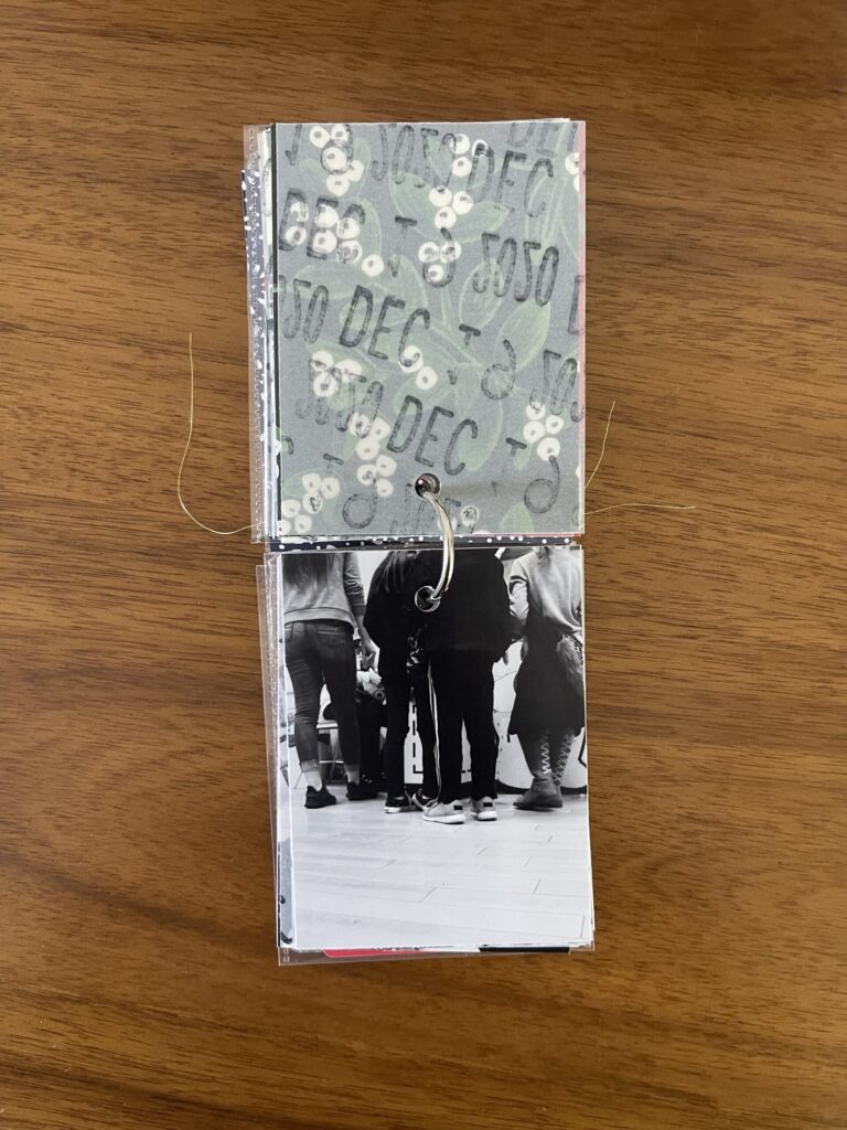 2020: the vellum page stamped with the date is flipped over to reveal a black-and-white photo of four kids in line to have their stuffed animals stuffed by the Build-A-Bear employee. 